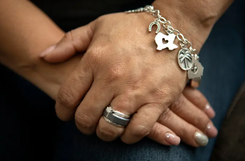 An undocumented woman in Houston clasps her hands during a 2019 interview. Texas studied the economic impact of its more than 1 million undocumented residents in 2006 but hasn't duplicated the study since.