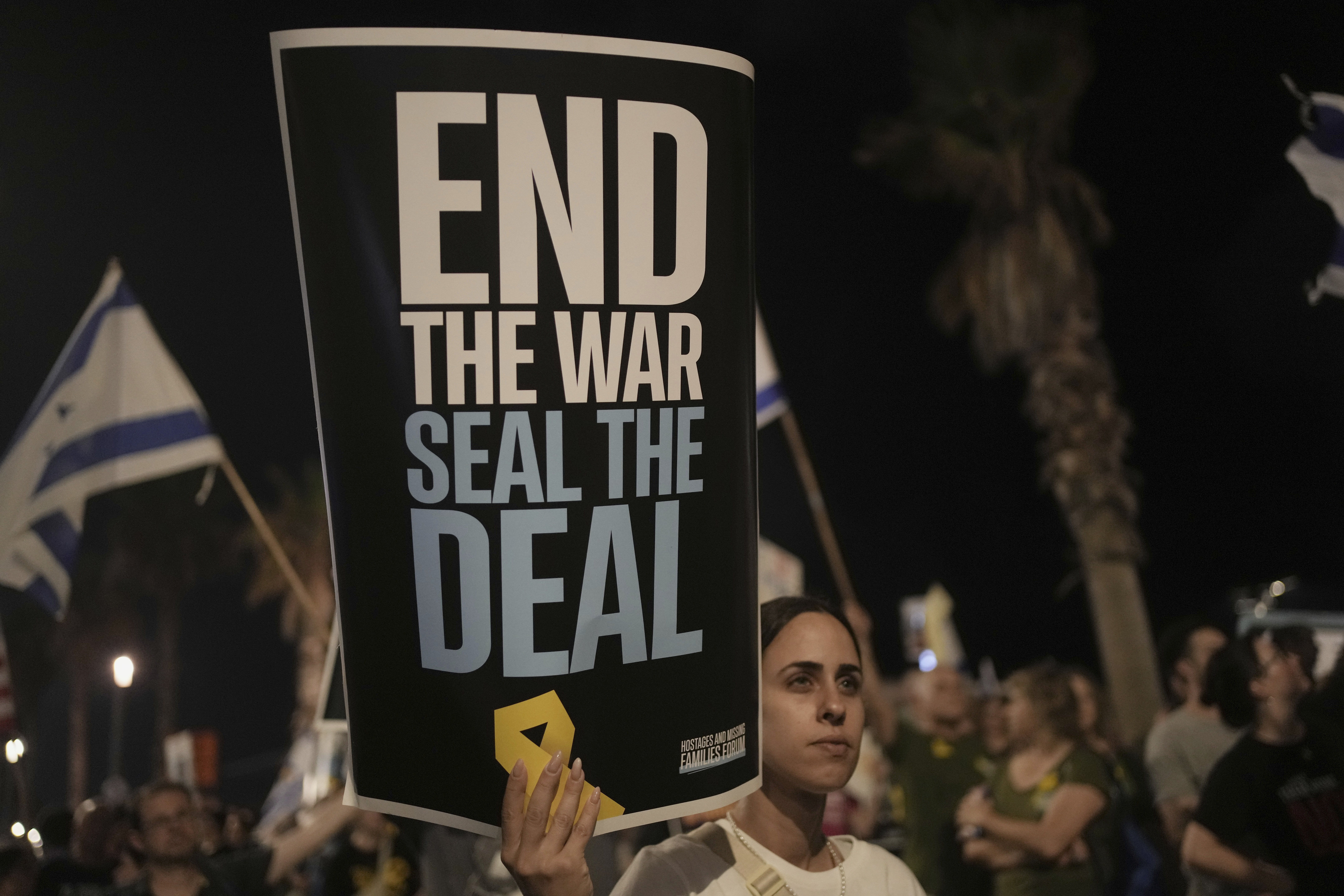People take part in a protest outside US Embassy Branch demanding the end of the war and immediate release of hostages held by Hamas in the Gaza Strip, and against Prime Minister Benjamin Netanyahu's government in Tel Aviv, Israel,