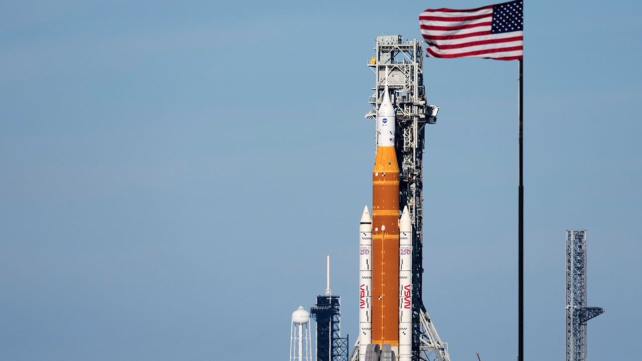 FILE - NASA's Artemis II SLS (Space Launch System) moon rocket with the Orion spacecraft slowly rolls back towards the Vehicle Assembly Building at the Kennedy Space Center, Feb. 25, 2026, in Cape Canaveral, Fla. (AP Photo/John Raoux, File