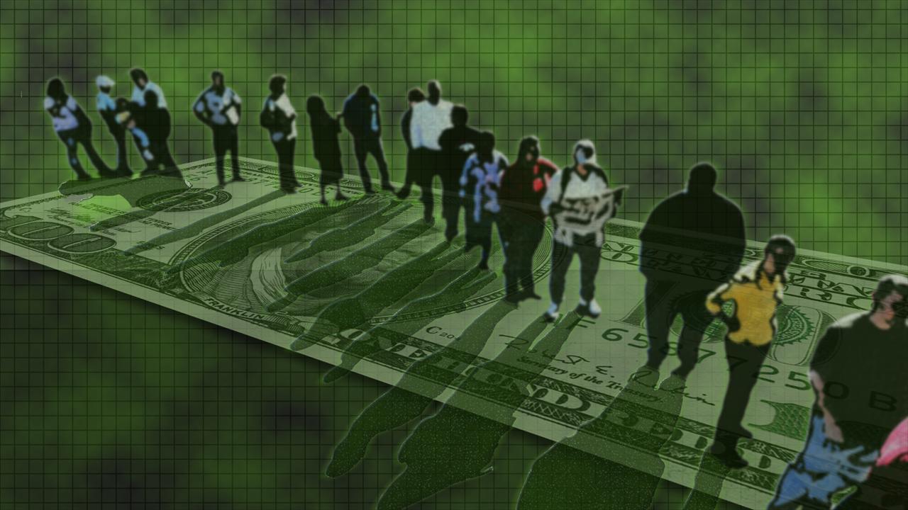 Workers standing on currency