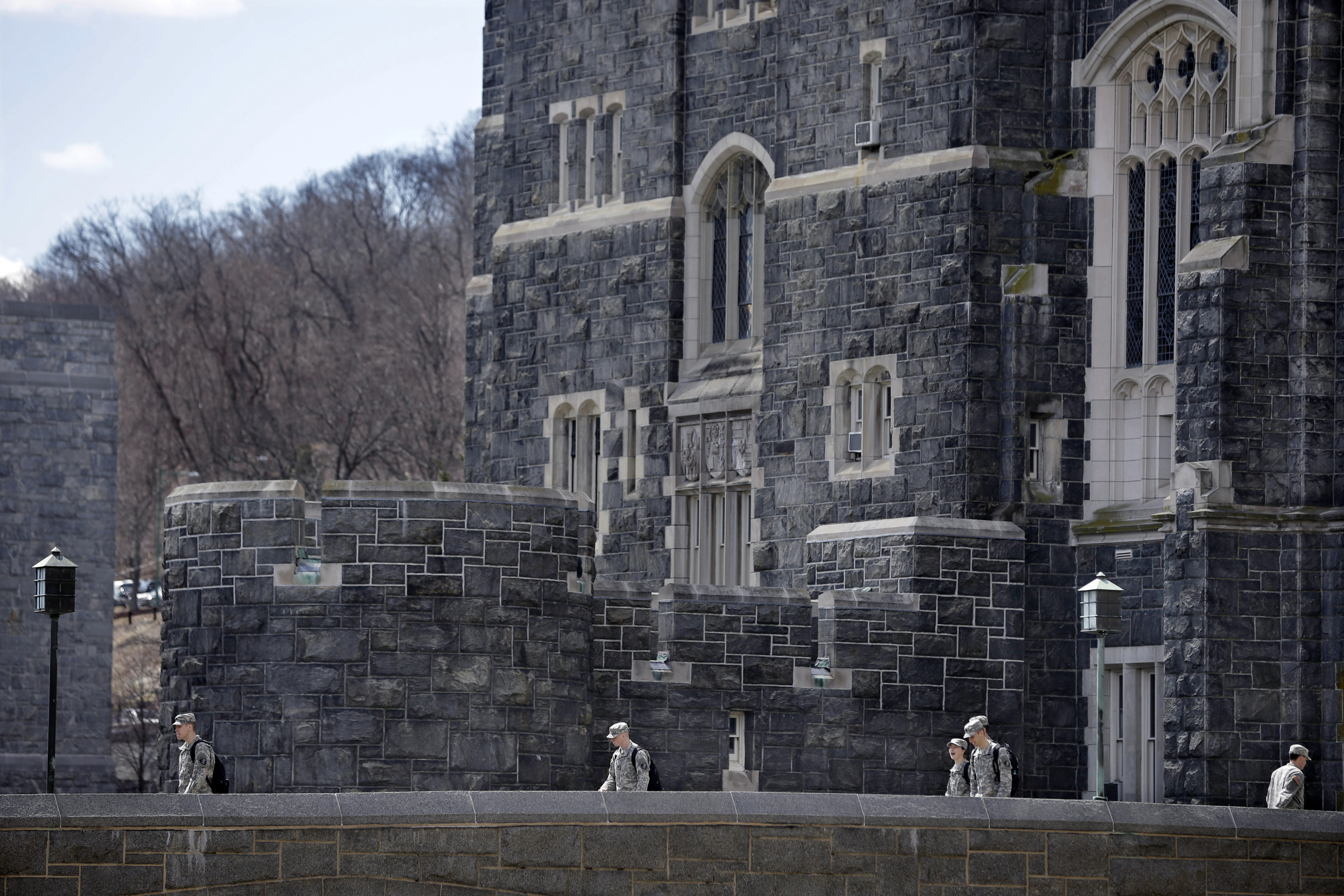 FILE - West Point cadets walk on campus during lunchtime break at the United States Military Academy in West Point, N.Y., April 9, 2014. 