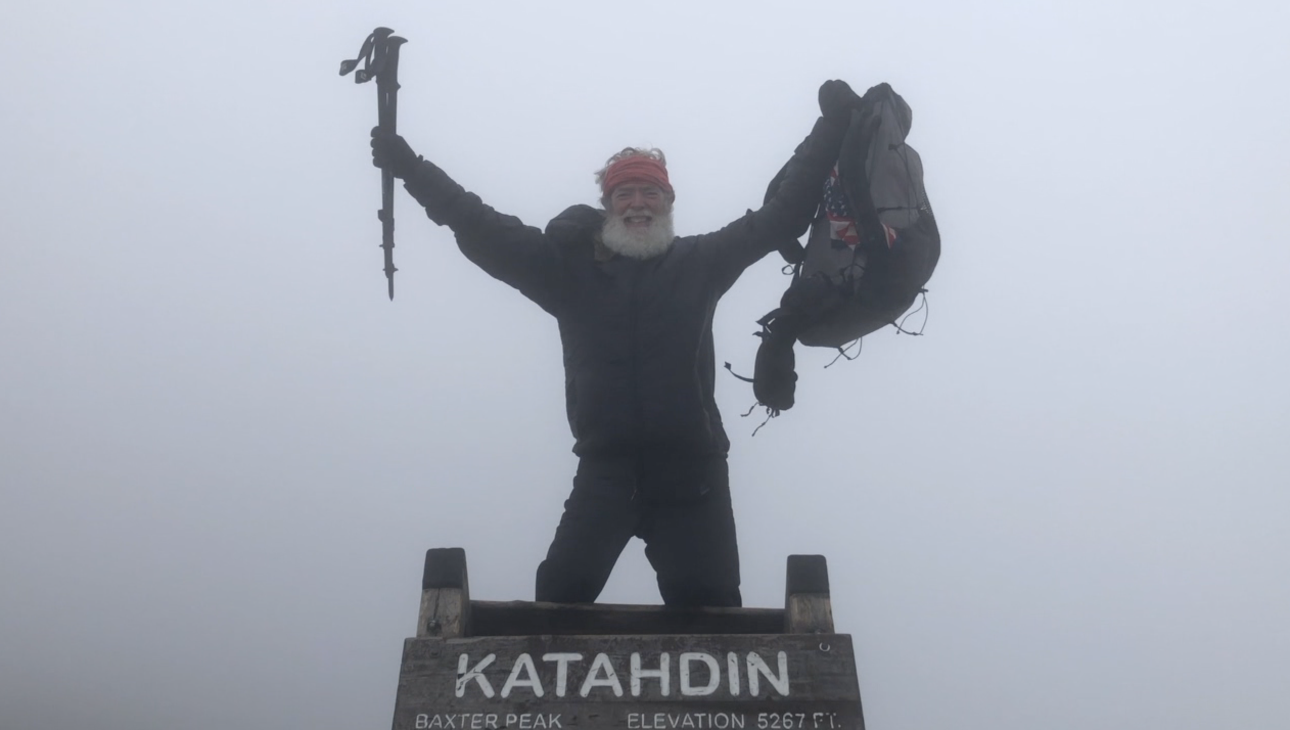 Kevin Newsome, 66, at the top of Mt. Katahdin after thru-hiking the Appalachian Trail.