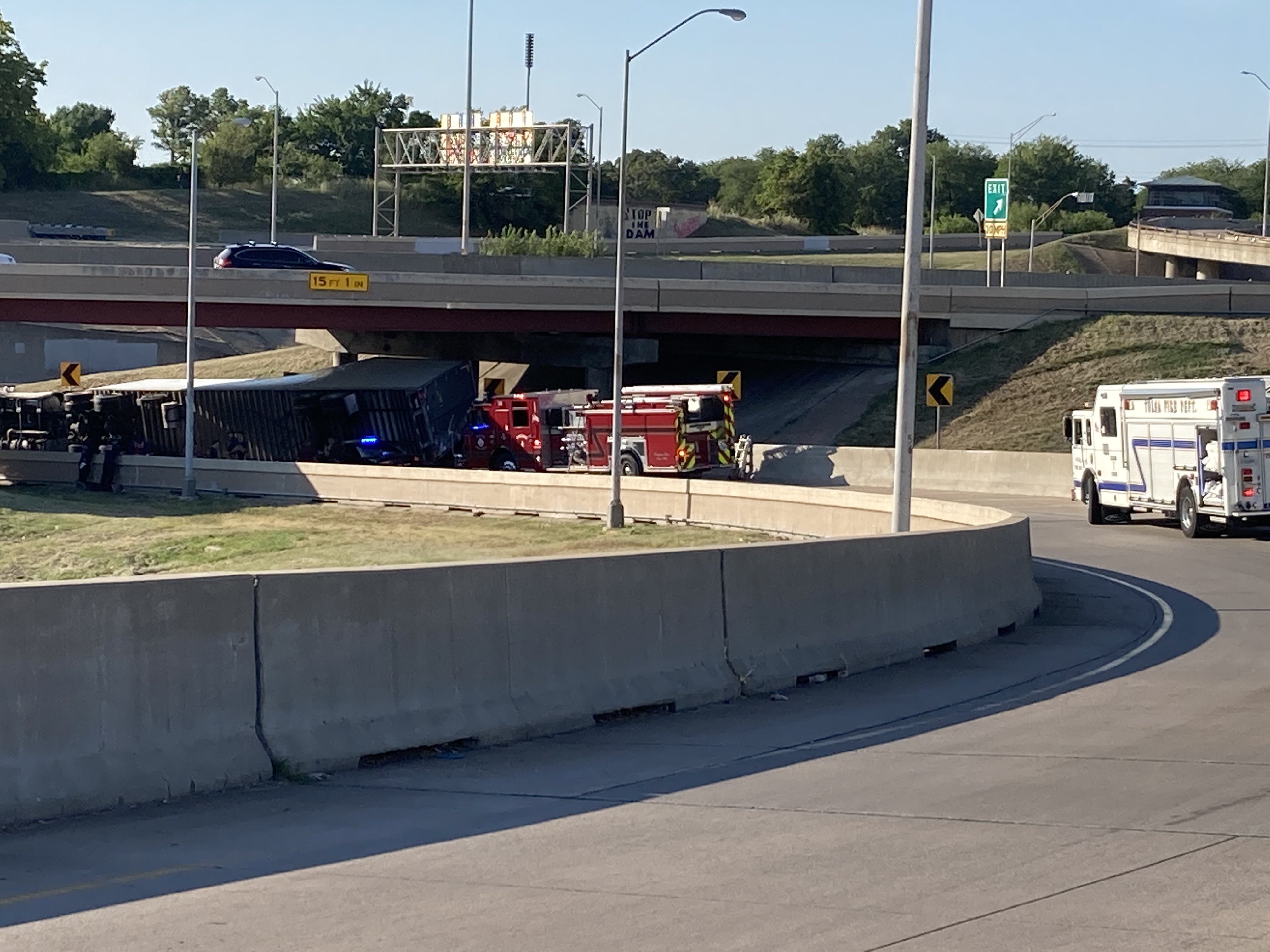 Semi carrying liquid cranberries rolls over