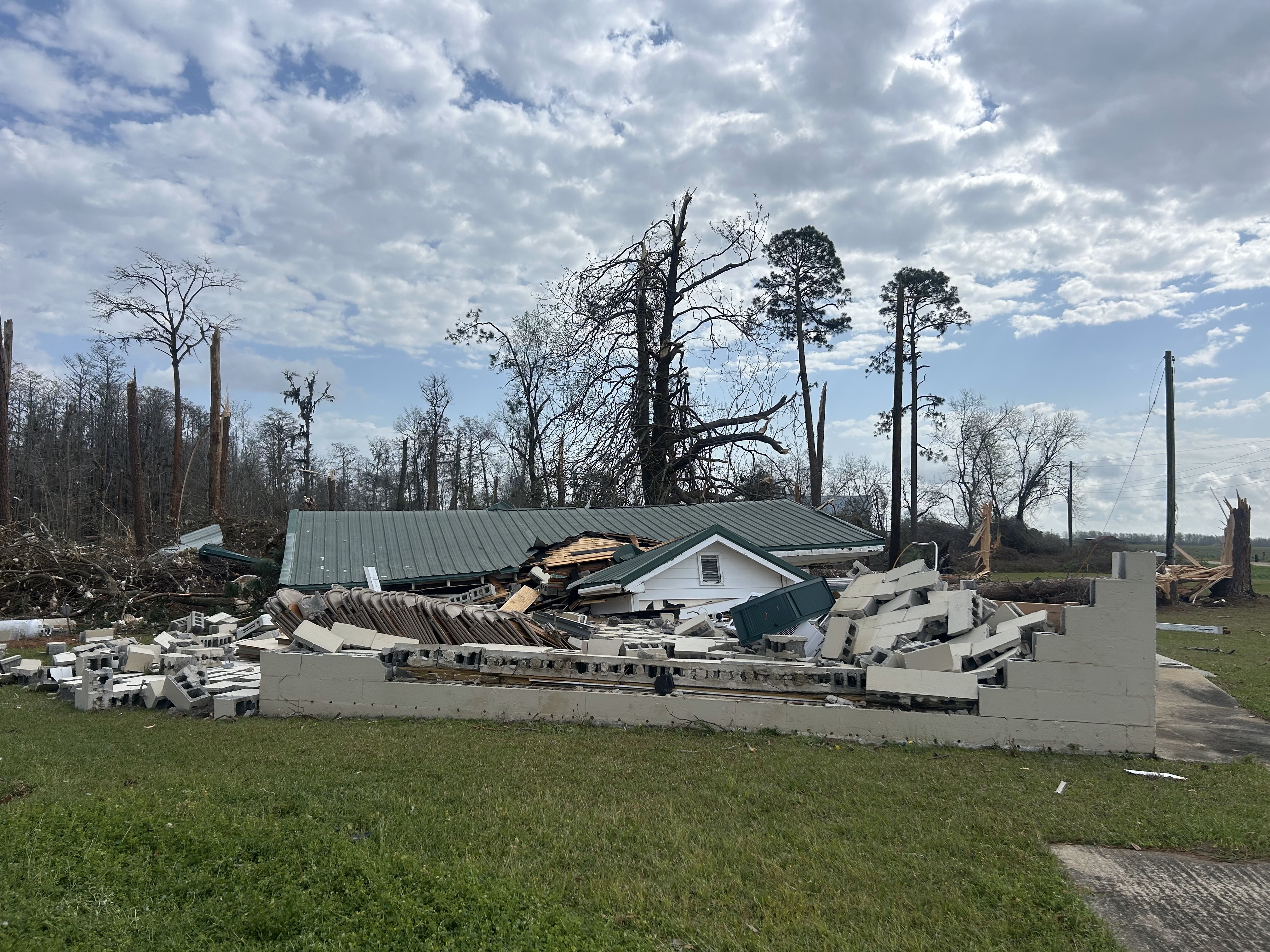 A roof sits atop the rubble of a community house in Pebble City. It collapsed during a tornado on March 16th.