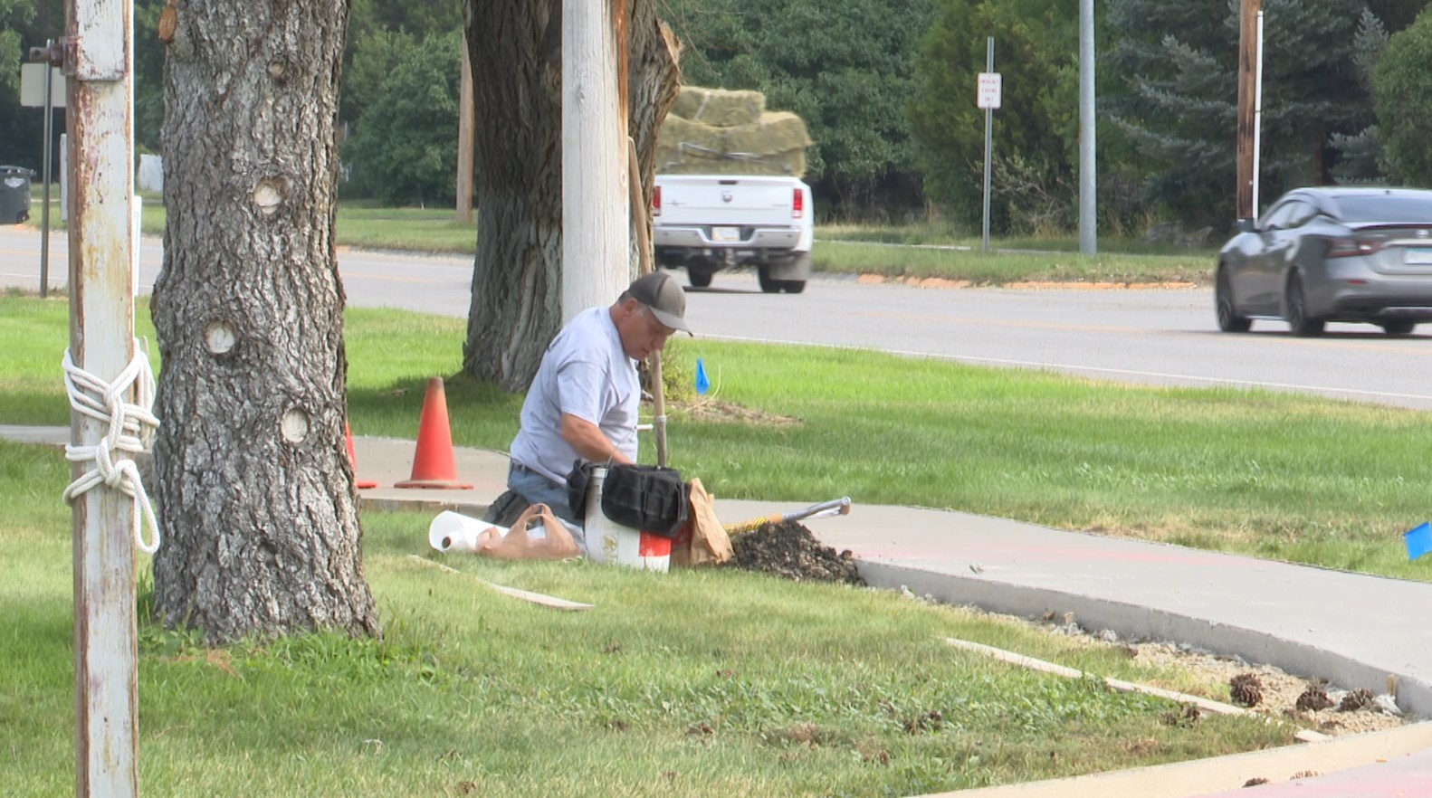 Joliet city employee working on sidewalk