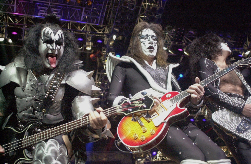Kiss guitarist Paul Stanley, right, guitarist Ace Frehley, center, and bassist Gene Simmons play during the band's farewell concert in the Detroit area, Thursday, May 25, 2000, at the Palace of Auburn Hills, Mich.