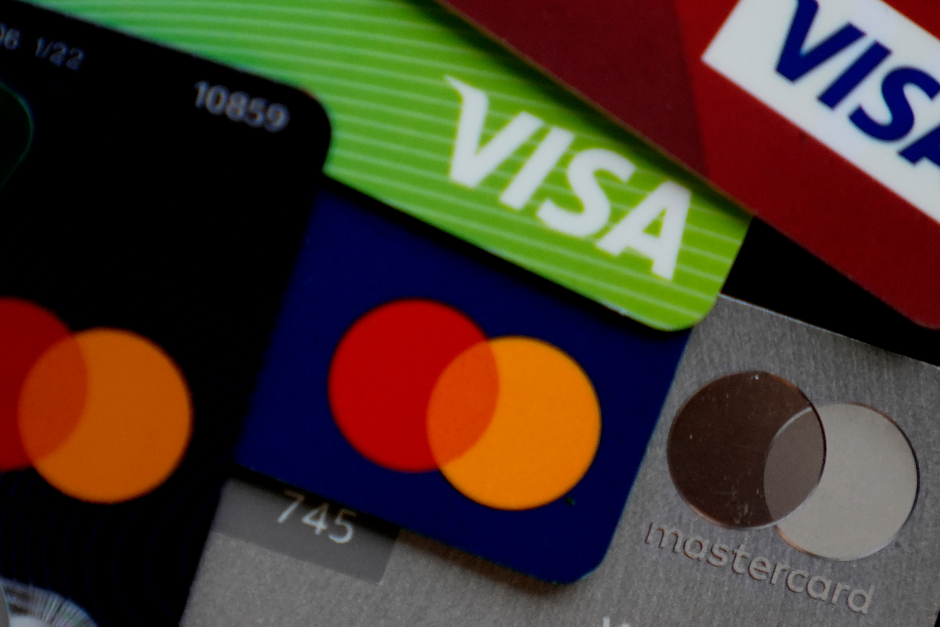 FILE - Visa and Mastercard credit cards are shown in Buffalo Grove, Ill., Feb. 8, 2024. 