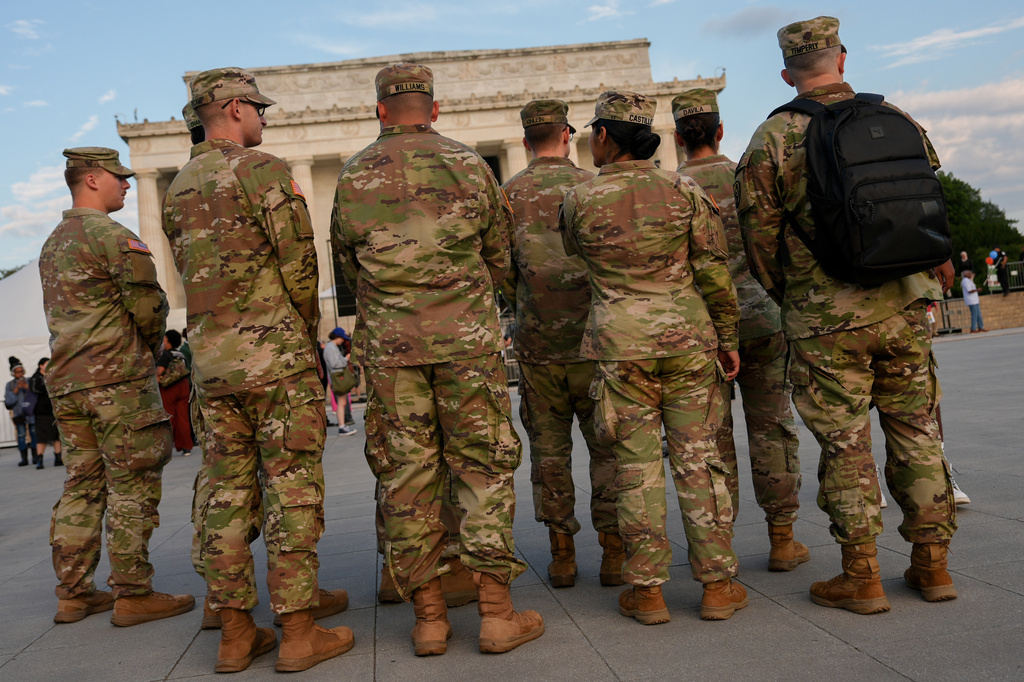 Members of the National Guard stand in front of the Lincoln Memorial before the March on Washington, Friday, Aug. 28, 2026, in Washington.
