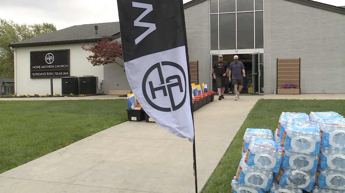  Pastor Cameron Presson, right, and Michael Clutter, walking from Hope Anthem Church in Ottawa, Kan.