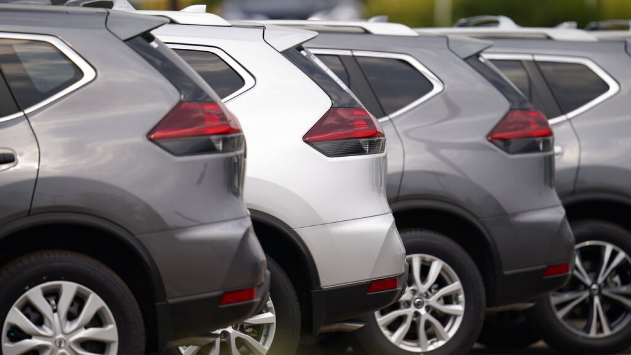 Nissan vehicles in a parking lot.