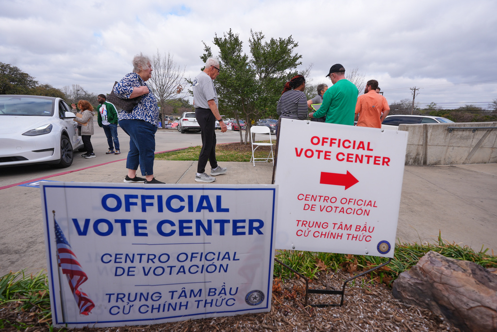 Primary voters arrive to cast ballots at an official vote center in Dallas, Tuesday, March 3, 2026.