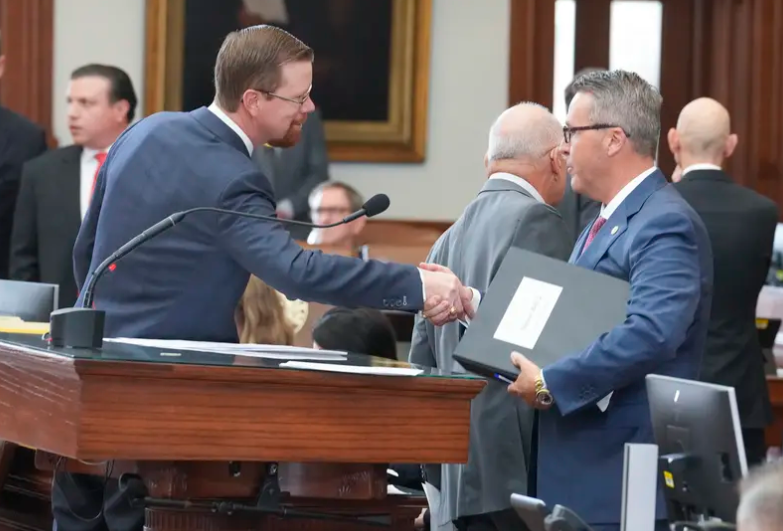 State Rep. Will Metcalf, R-Conroe, shakes hands with Rep. Brad Buckley R-Salado, House Education chair, after the vote on school finance on April 16, 2025. The bill passed, 144-4.