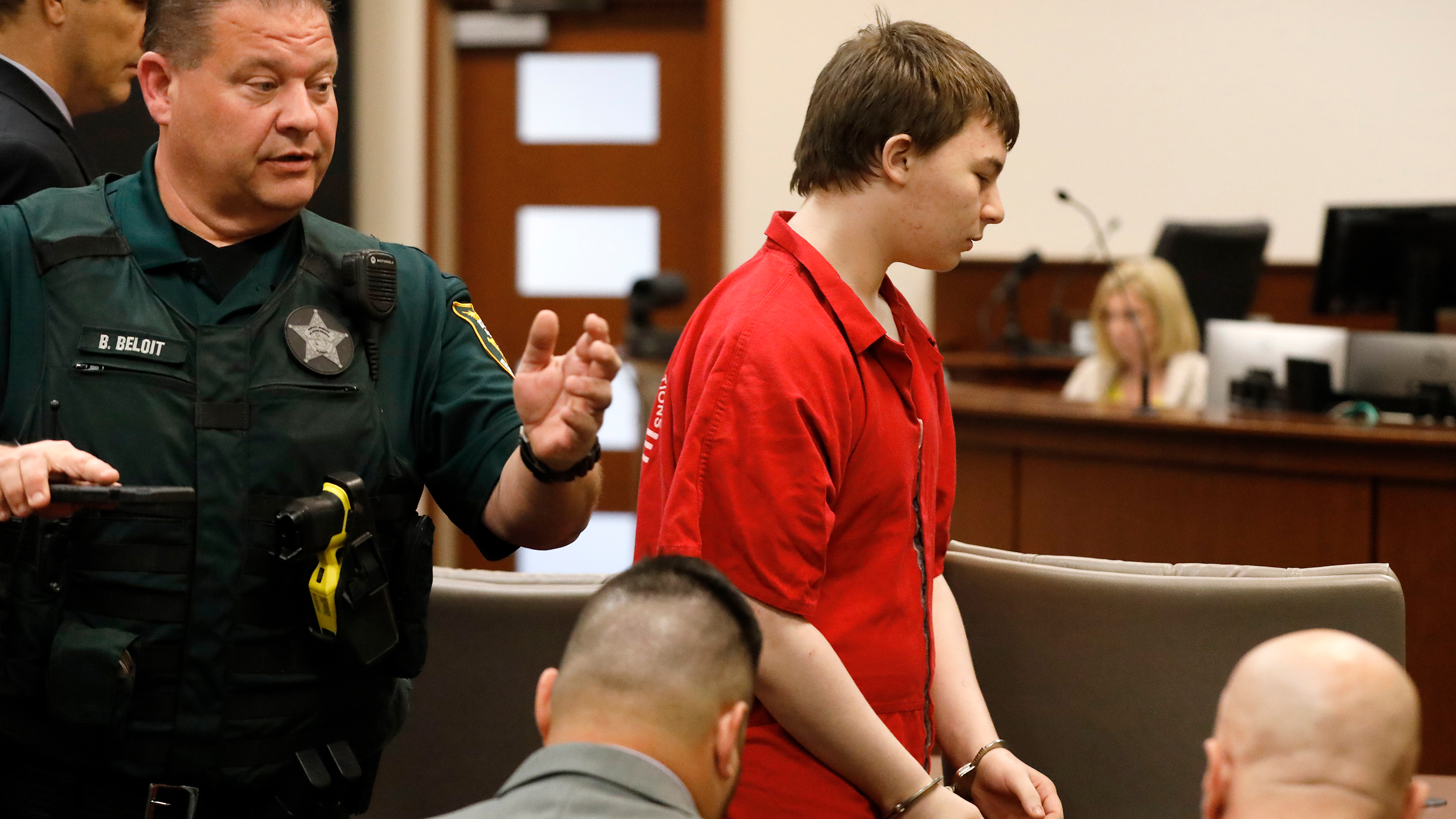 Aiden Fucci is led into the courtroom to start his sentencing hearing, Friday, March 24, 2023. in St. Augustine, Fla. A Florida judge sentenced the 16-year-old Florida boy to life in prison on Friday for fatally stabbing a 13-year-old classmate on Mother's Day in 2021. Fucci, who pleaded guilty just before his trial was set to start in February, was not eligible for the death penalty.