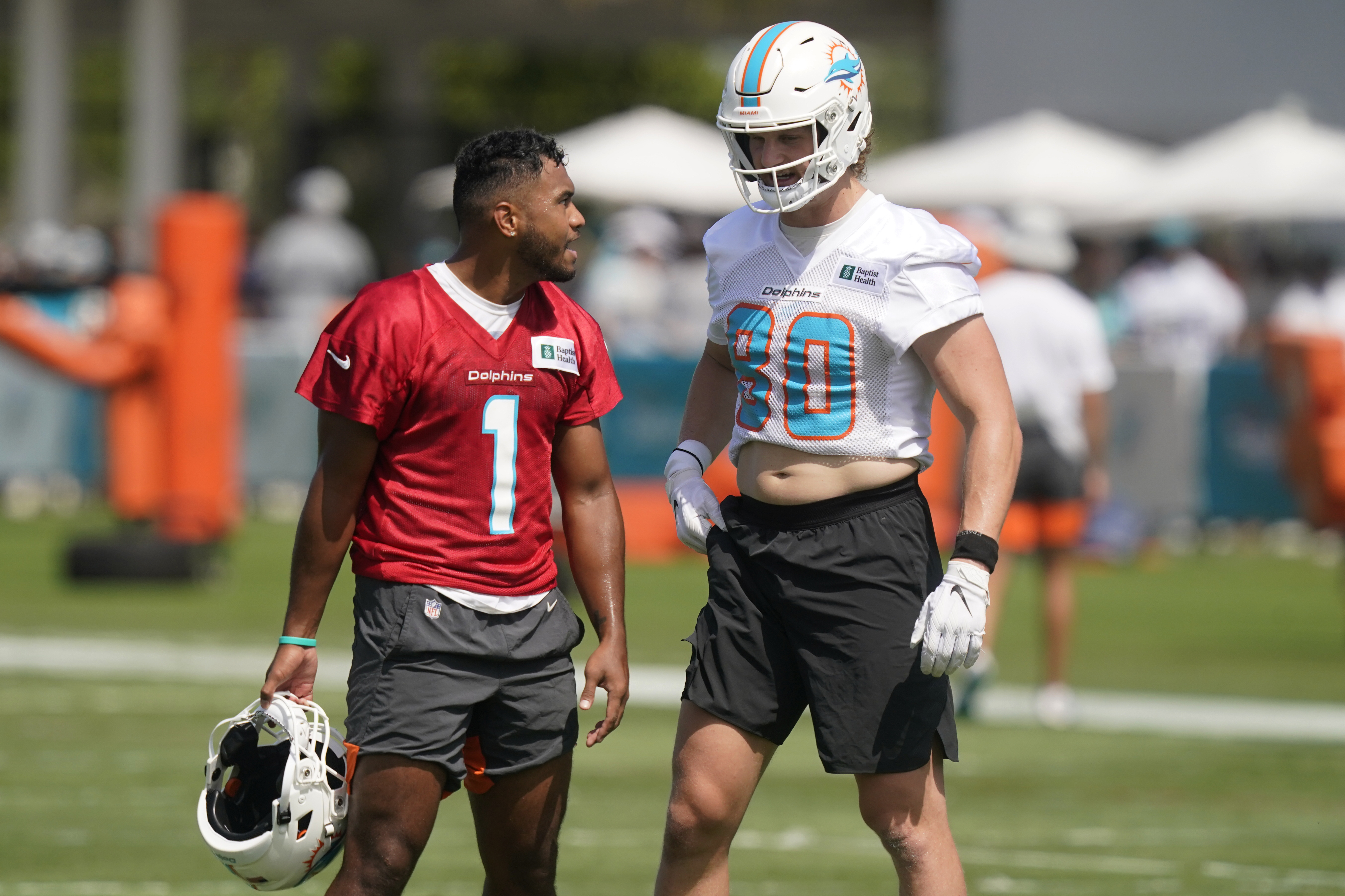 Miami Dolphins QB Tua Tagovailoa speaks to tight end Adam Shaheen during practice, July 31, 2021
