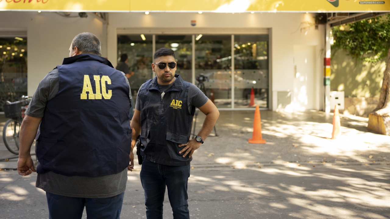 Police gather outside the Unico supermarket, Rosario, Argentina, Thursday, March 2, 2023.