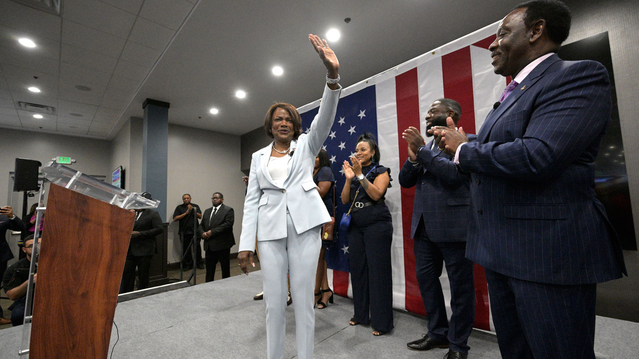 U.S. Rep. Val Demings, D-Fla., front, the Democratic candidate for the U.S. Senate, addresses supporters as her husband, Orange County Mayor Jerry Demings, right, watches during a primary election party on Tuesday, Aug. 23, 2022, in Orlando, Fla. 