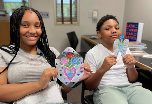 Kids at Washington Park Library making Hojalata Tin Art for Hispanic Heritage Month