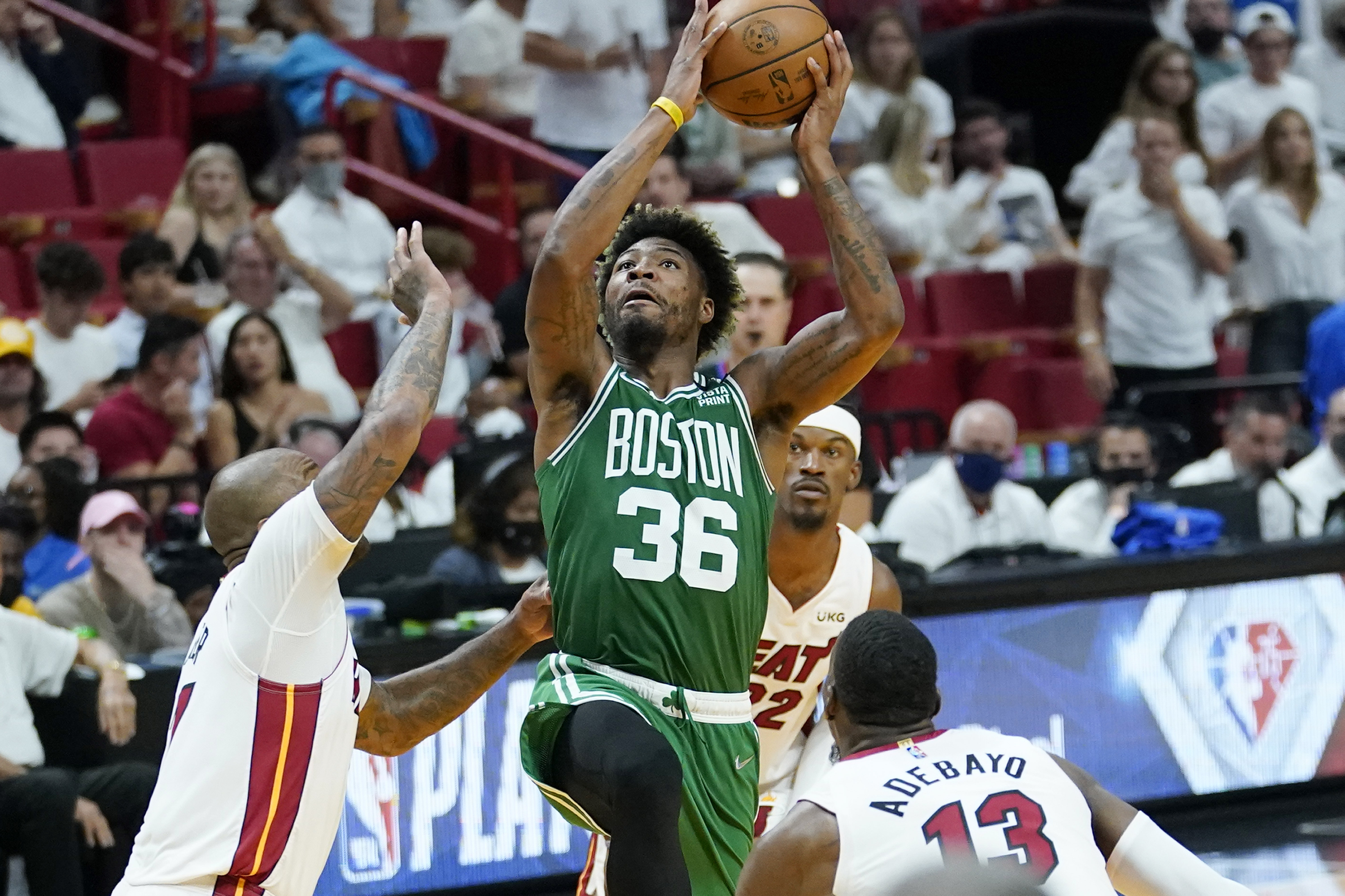 Boston Celtics guard Marcus Smart swarmed by Miami Heat forward P.J. Tucker, forward Jimmy Butler and center Bam Adebayo, May 29, 2022