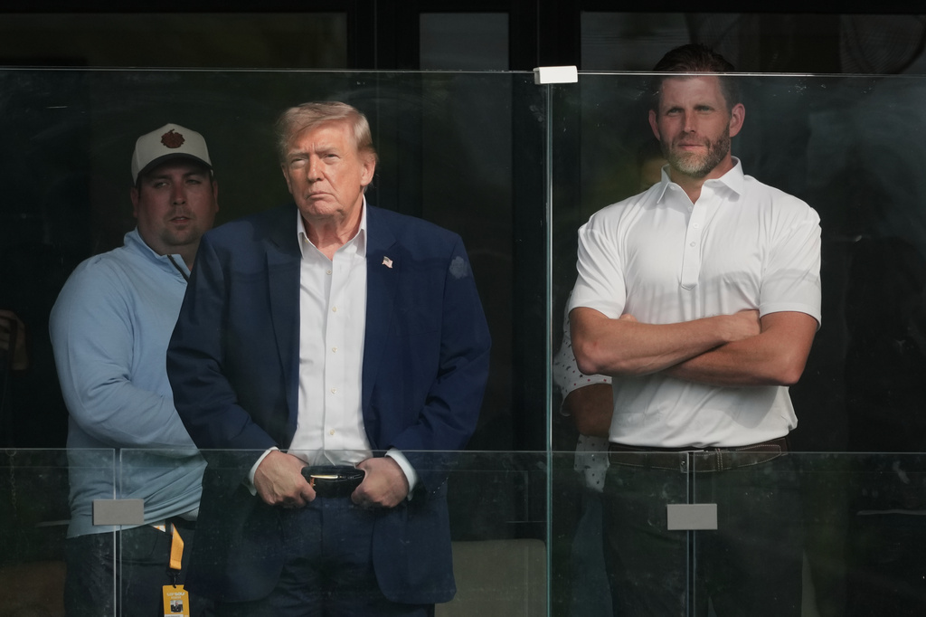 President Donald Trump and Eric Trump watch the Maaden LIV Golf Virginia tournament at Trump National Golf Club, Saturday, May 9, 2026, in Sterling, Va.