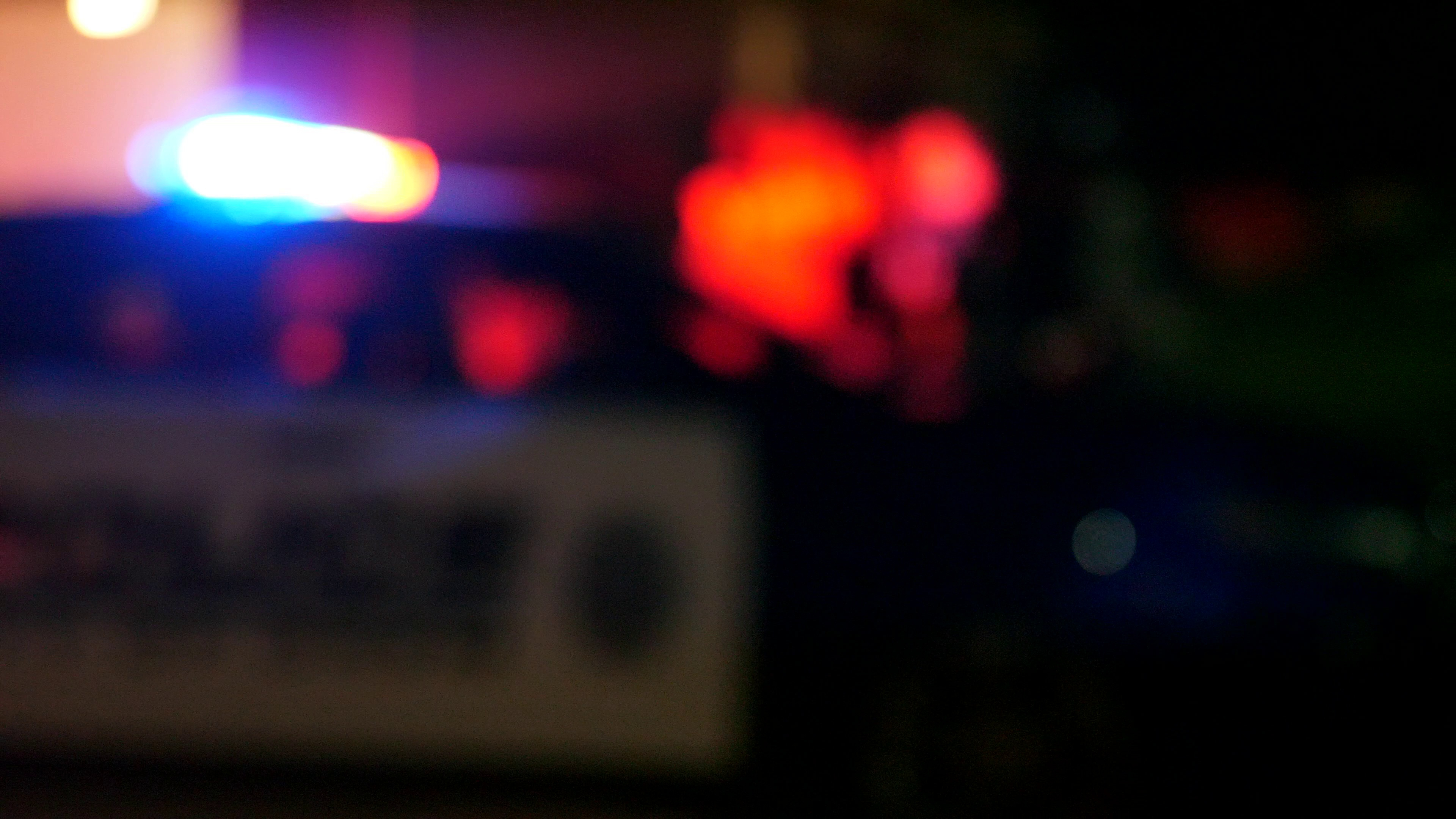 emergency-police-lights-flash-at-night-at-a-crime-scene-SBI-351140383.jpg
