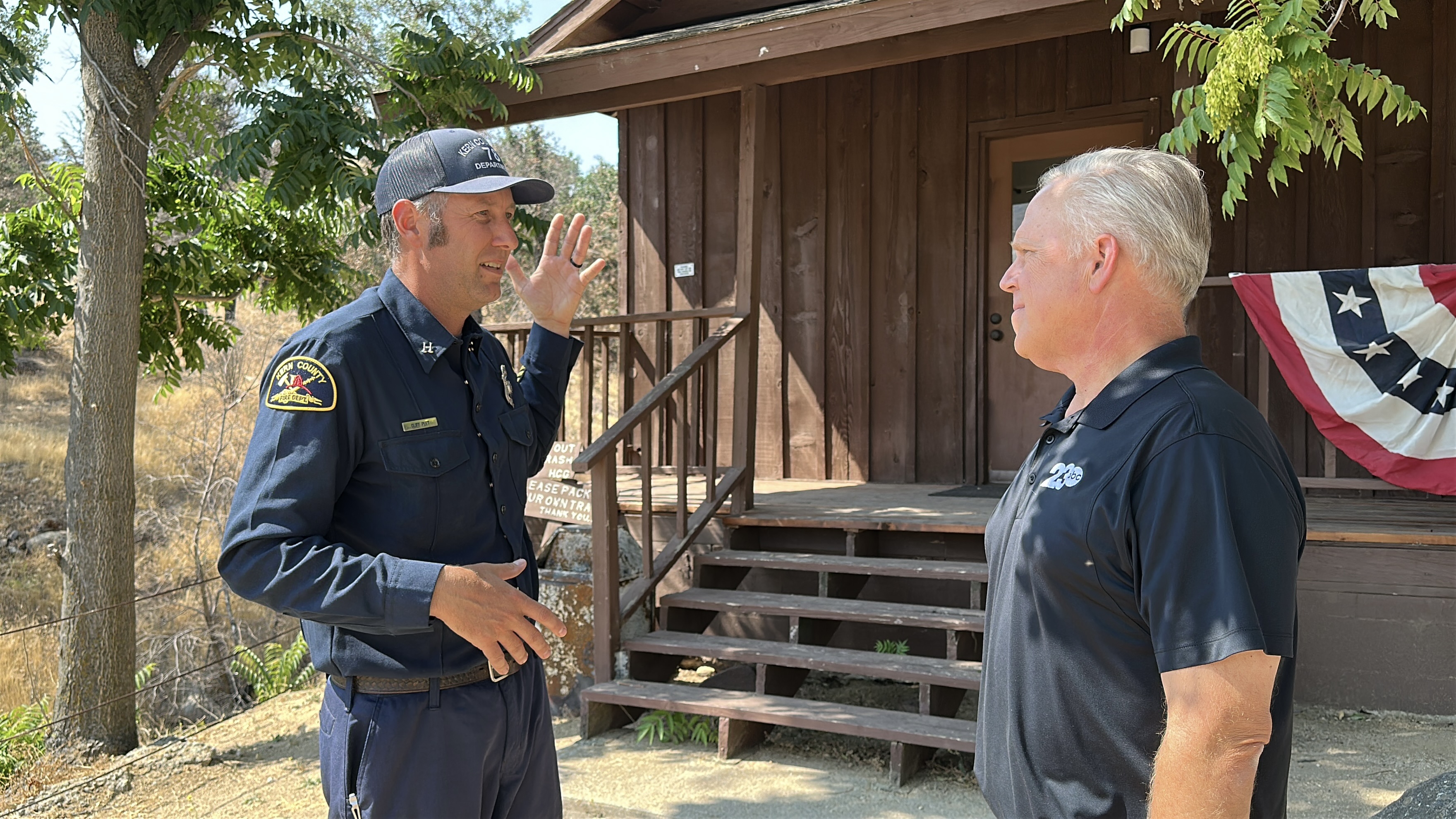 Capt Cliff Peet and Mike Hart outside historic Havilah schoolhouse