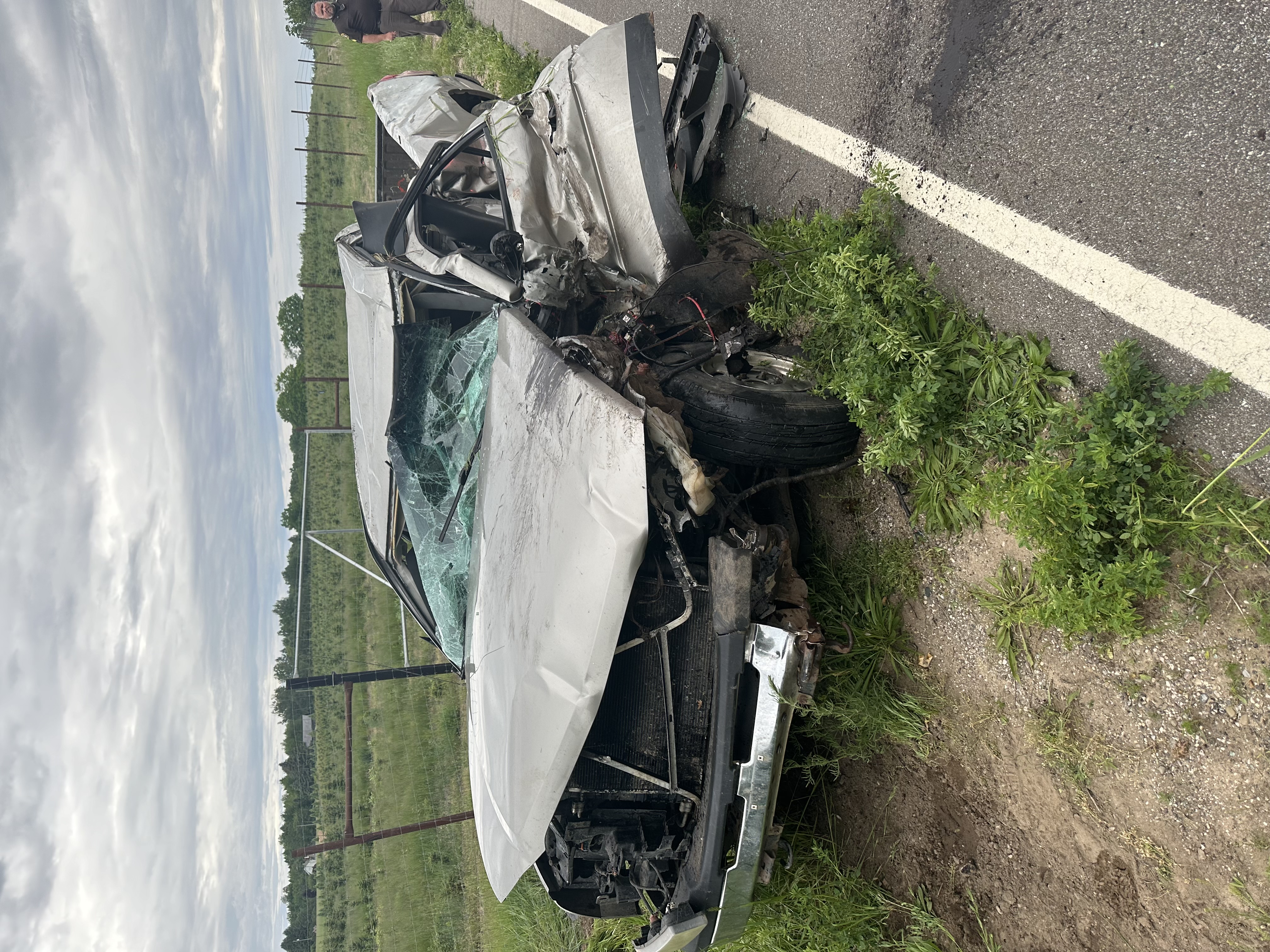 Pickup hits farm implement, rolls