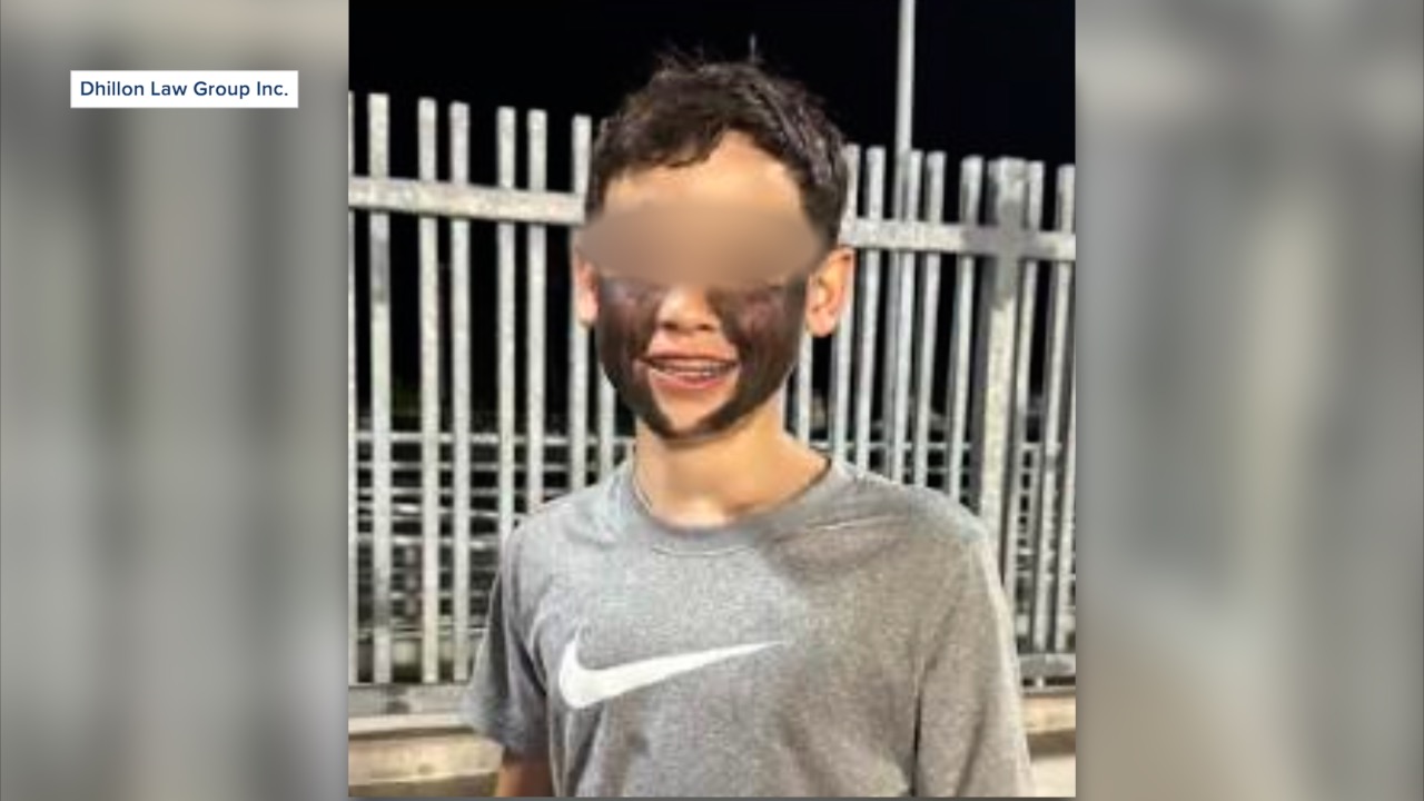 A 13-year-old boy painted part of his face black during a high school football game.
