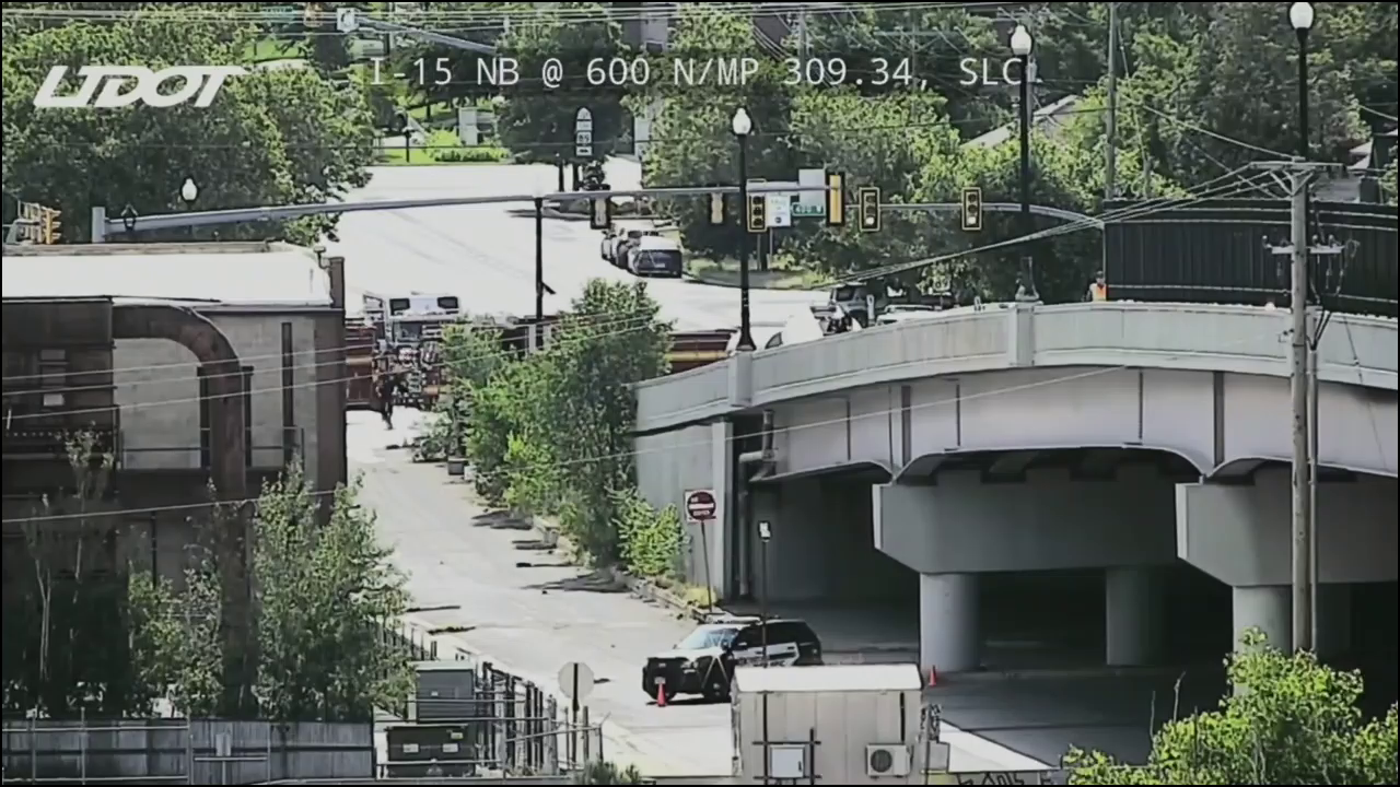 A snapshot from a UDOT traffic camera. Fire engines block off the I-15 on-ramp as they secure the area.