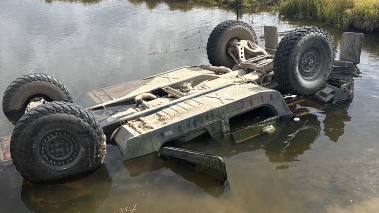 Man dies after vehicle flips and submerges in water