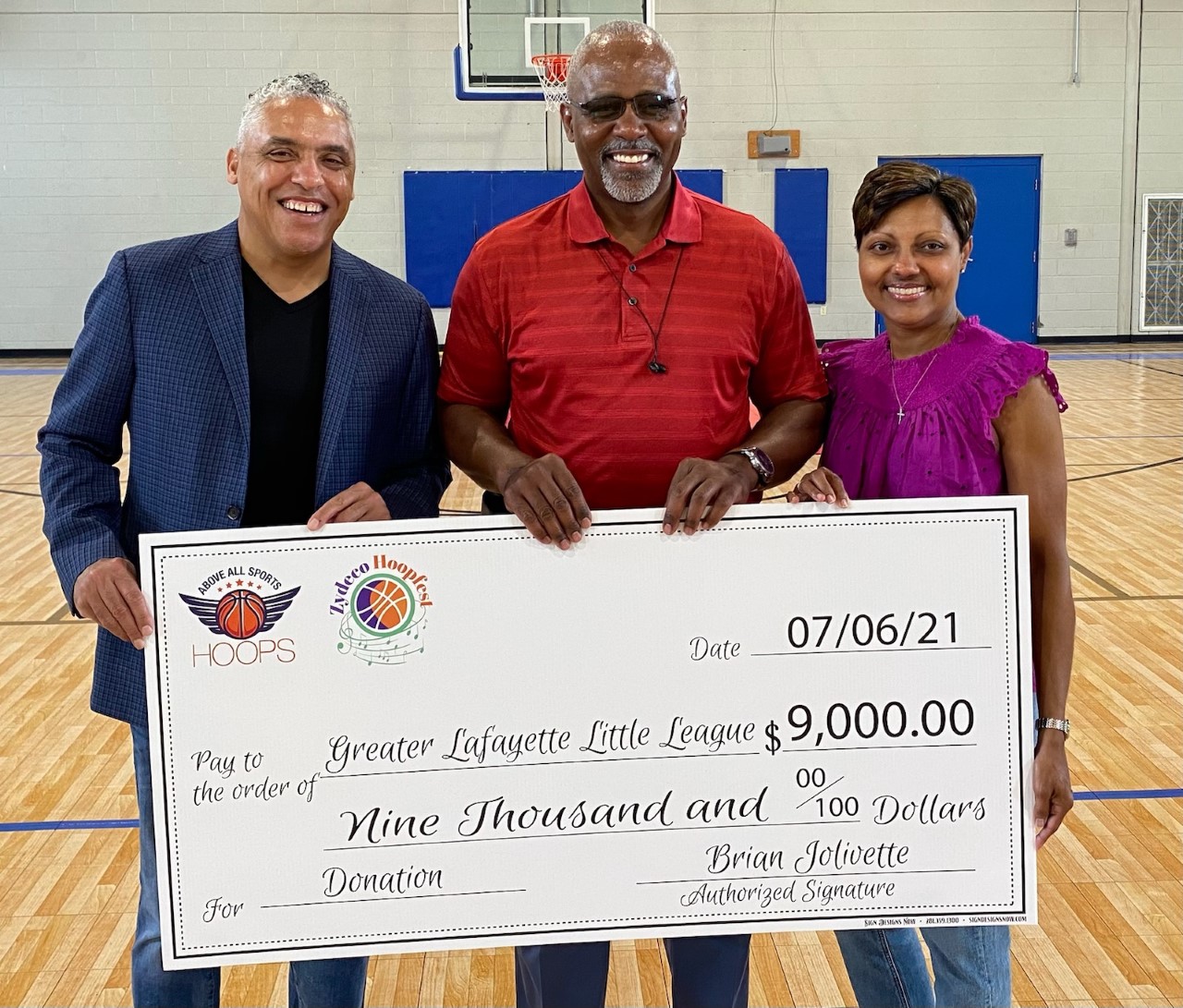 thumbnail_Zydeco Hoopfest Check Donation .jpg