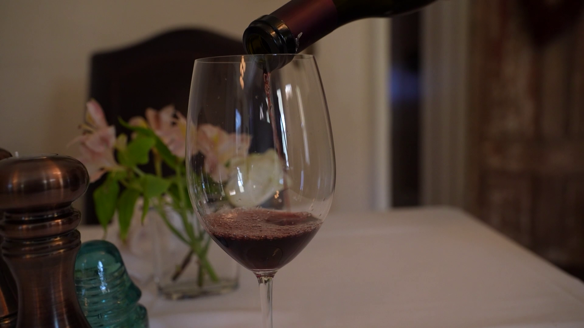 pouring a glass of wine