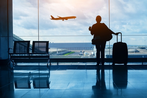 Stock image of a traveler inside an airport.