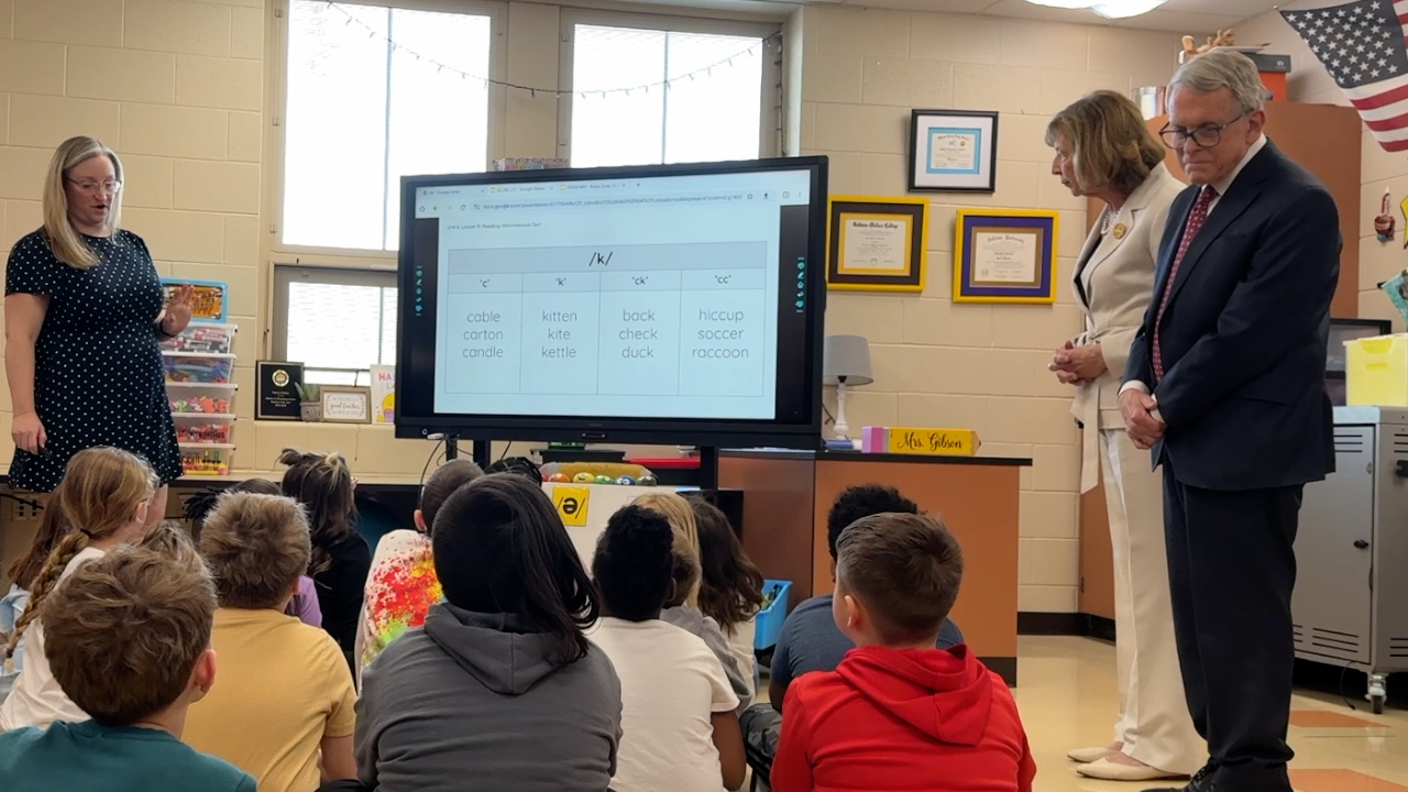 Ohio Gov. Mike DeWine looking at children