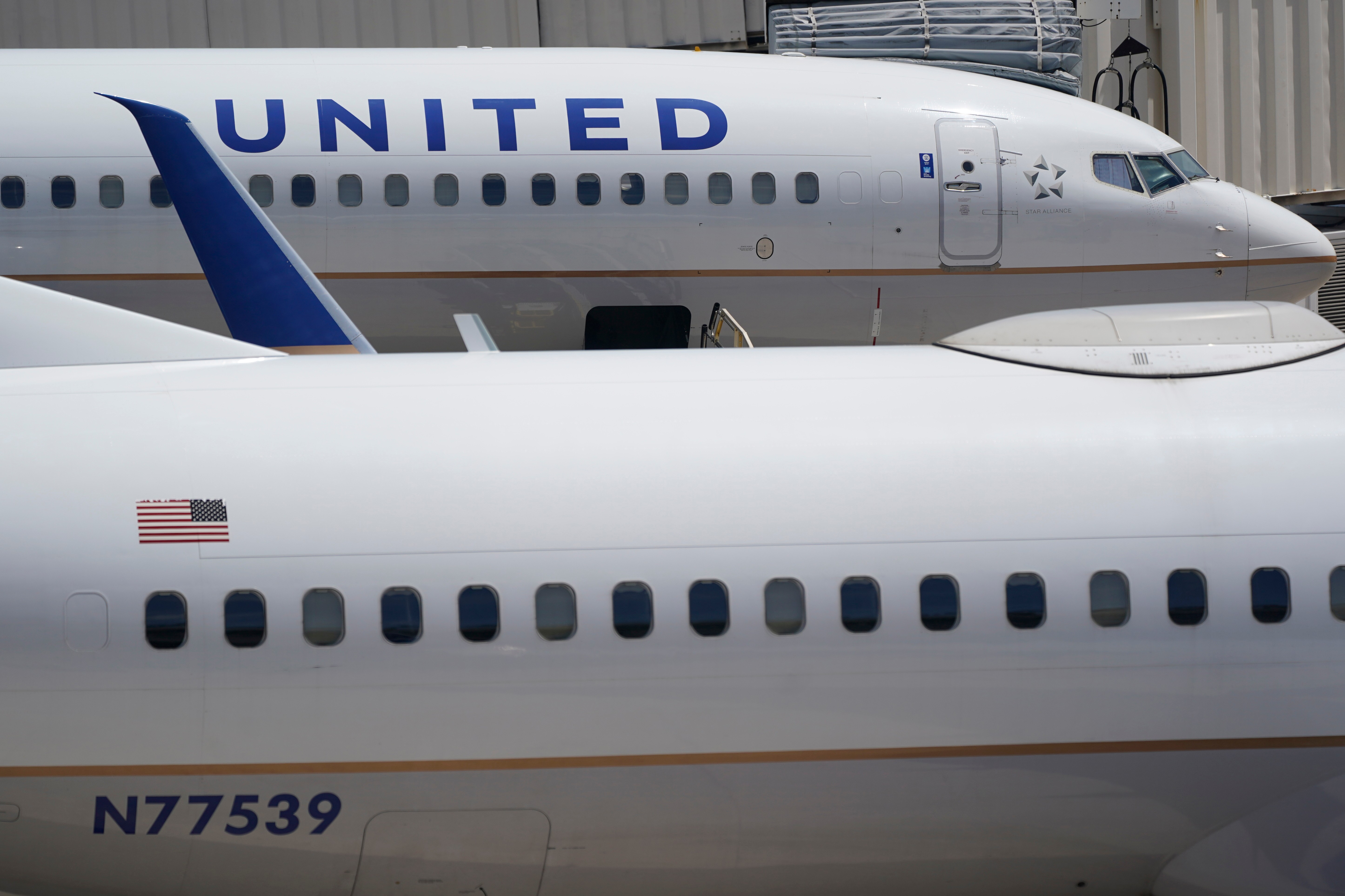 FILE - Two United Airlines Boeing 737s are shown parked at the gate, July 7, 2022, at the Fort Lauderdale-Hollywood International Airport in Fort Lauderdale, Fla. 