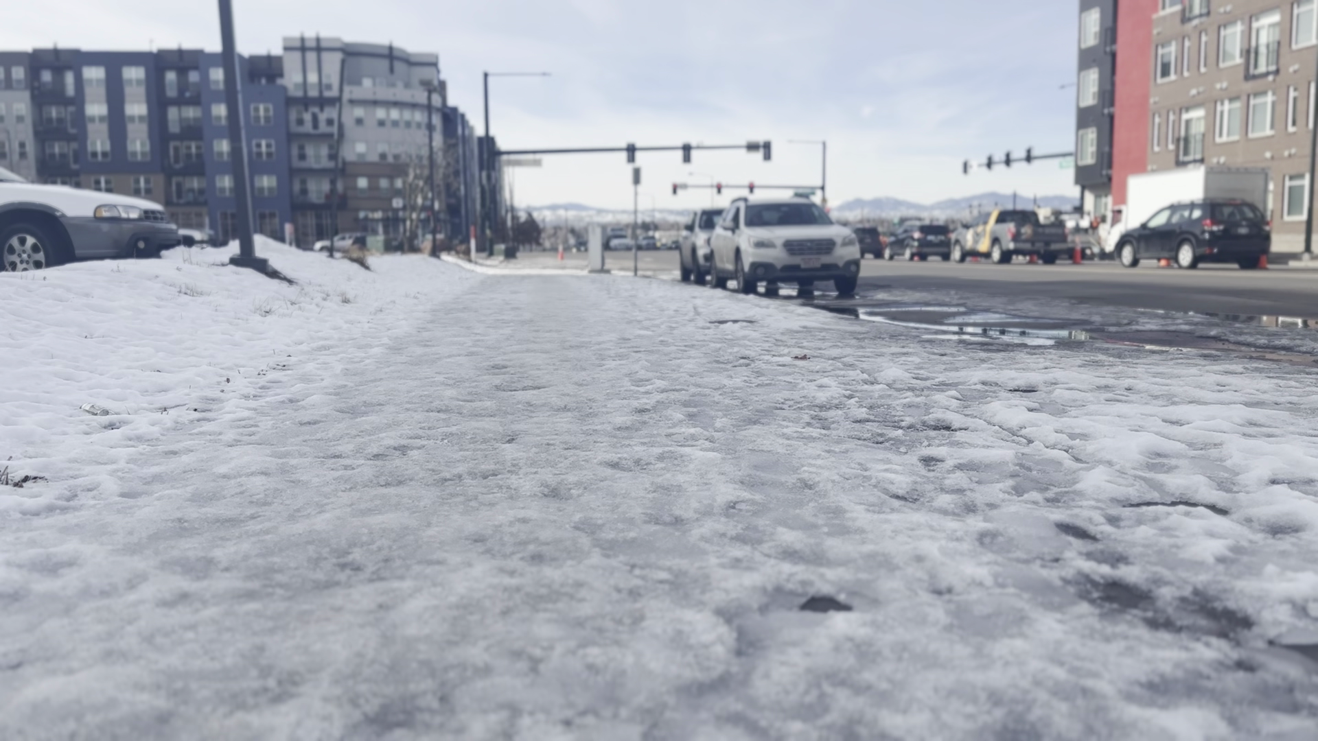 Snow and ice covered sidewalk in Denver