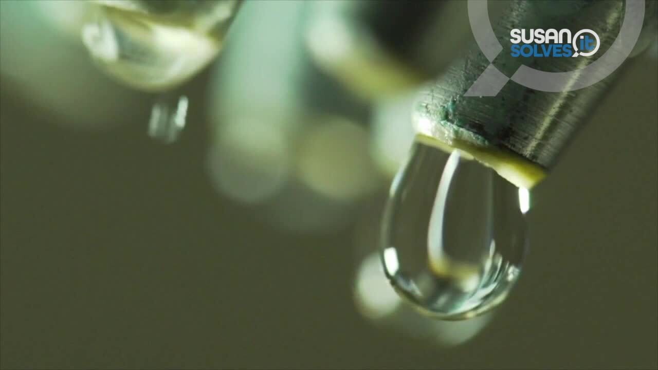 Water drips from a faucet.