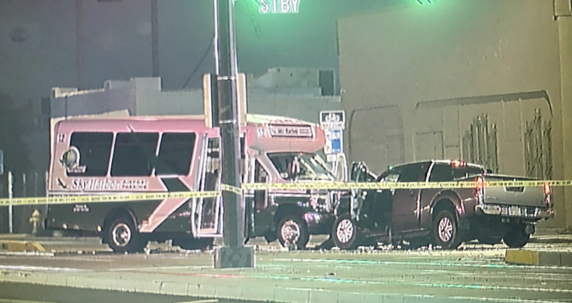 Woman critical after airport shuttle hit by red-light runner 