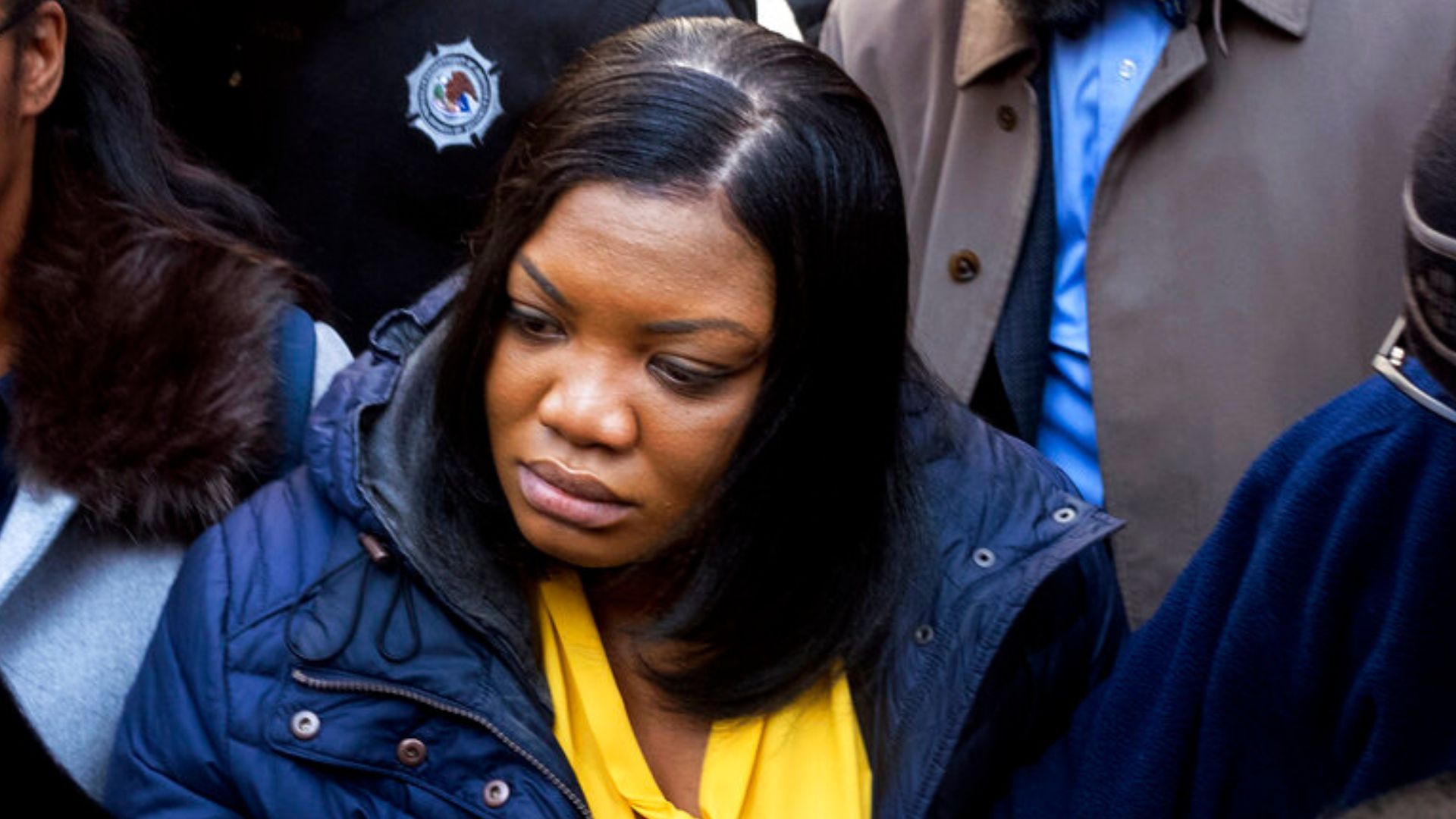 In this Nov. 25, 2019 file photo, Tova Noel, center in yellow blouse, a federal jail guard responsible for monitoring Jeffrey Epstein the night he killed himself, leaves federal court, in New York.