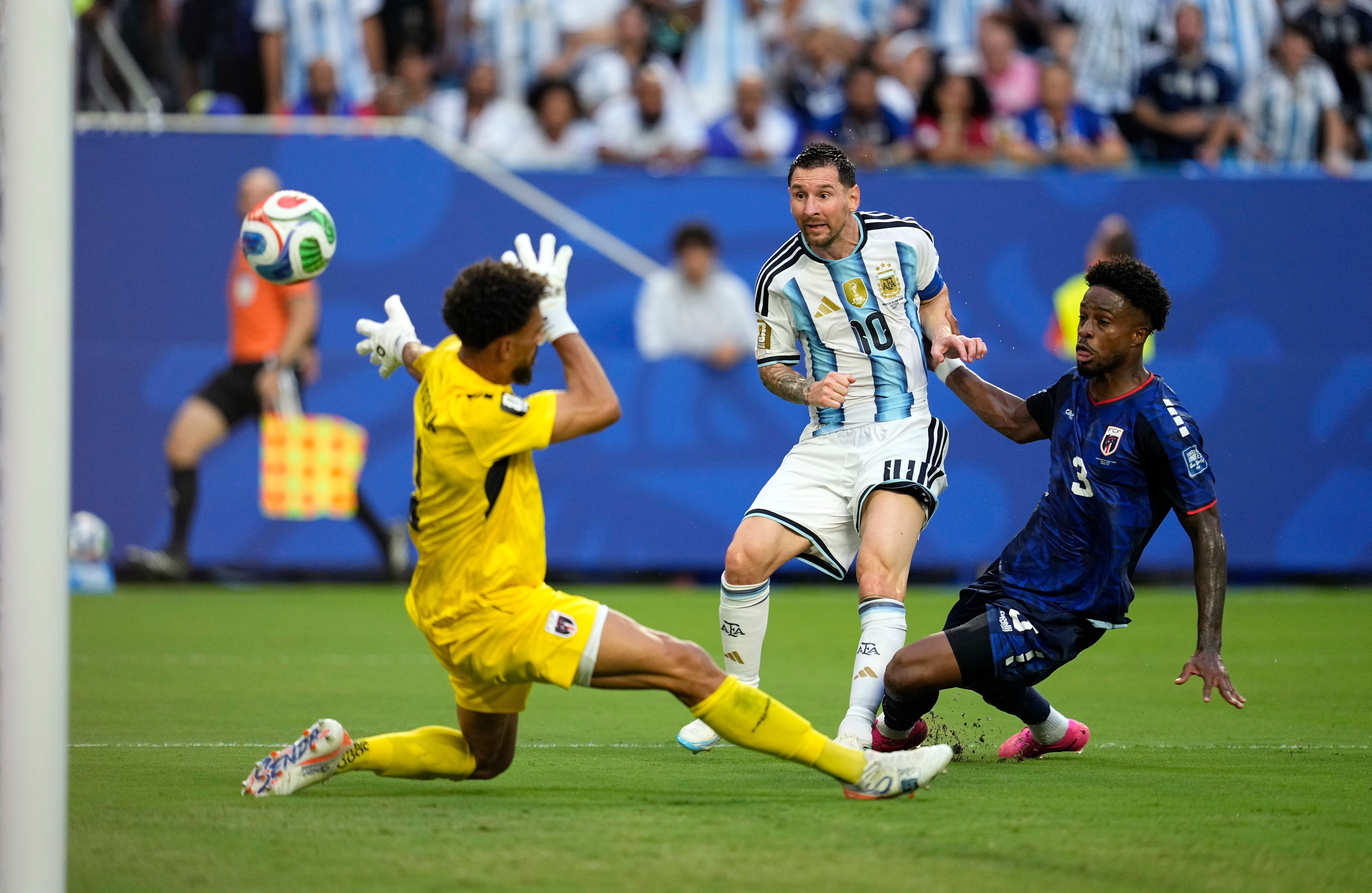 Argentina's Lionel Messi (10) scores their first goal against Cape Verde goalkeeper Vozinha (1) during the World Cup round of 32 soccer match between Argentina and Cape Verde in Miami Gardens, Fla., Friday, July 3, 2026.