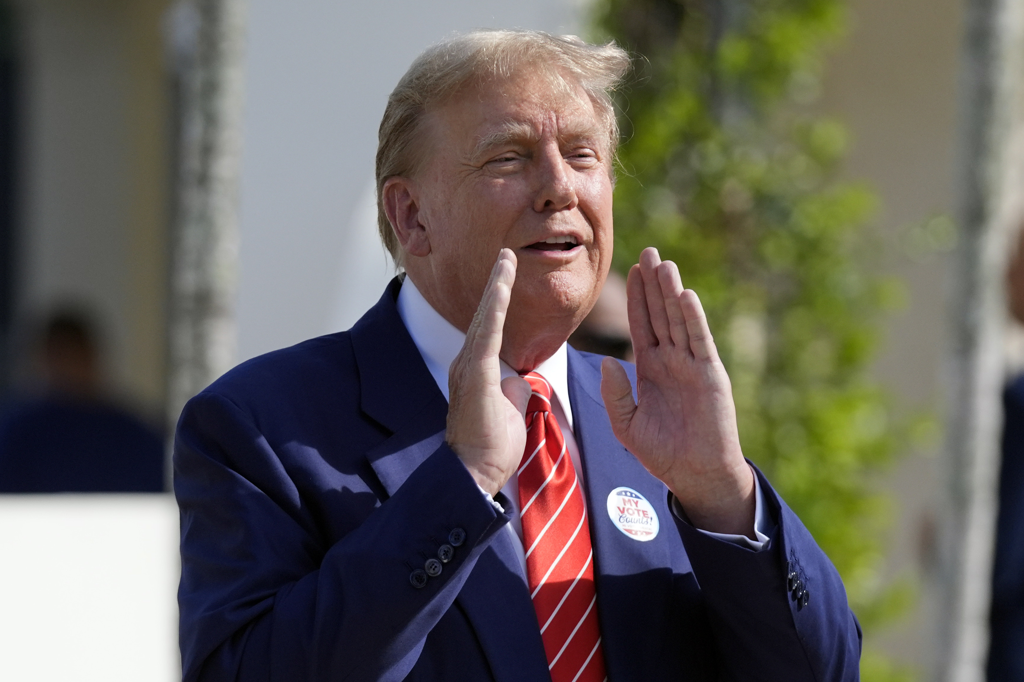Former President Donald Trump tells reporters he voted for himself in Palm Beach, March 19, 2024