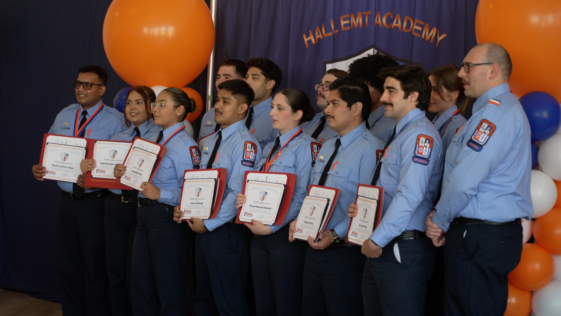 Hall Ambulance graduates 12 new EMTs with personal stories driving their passion