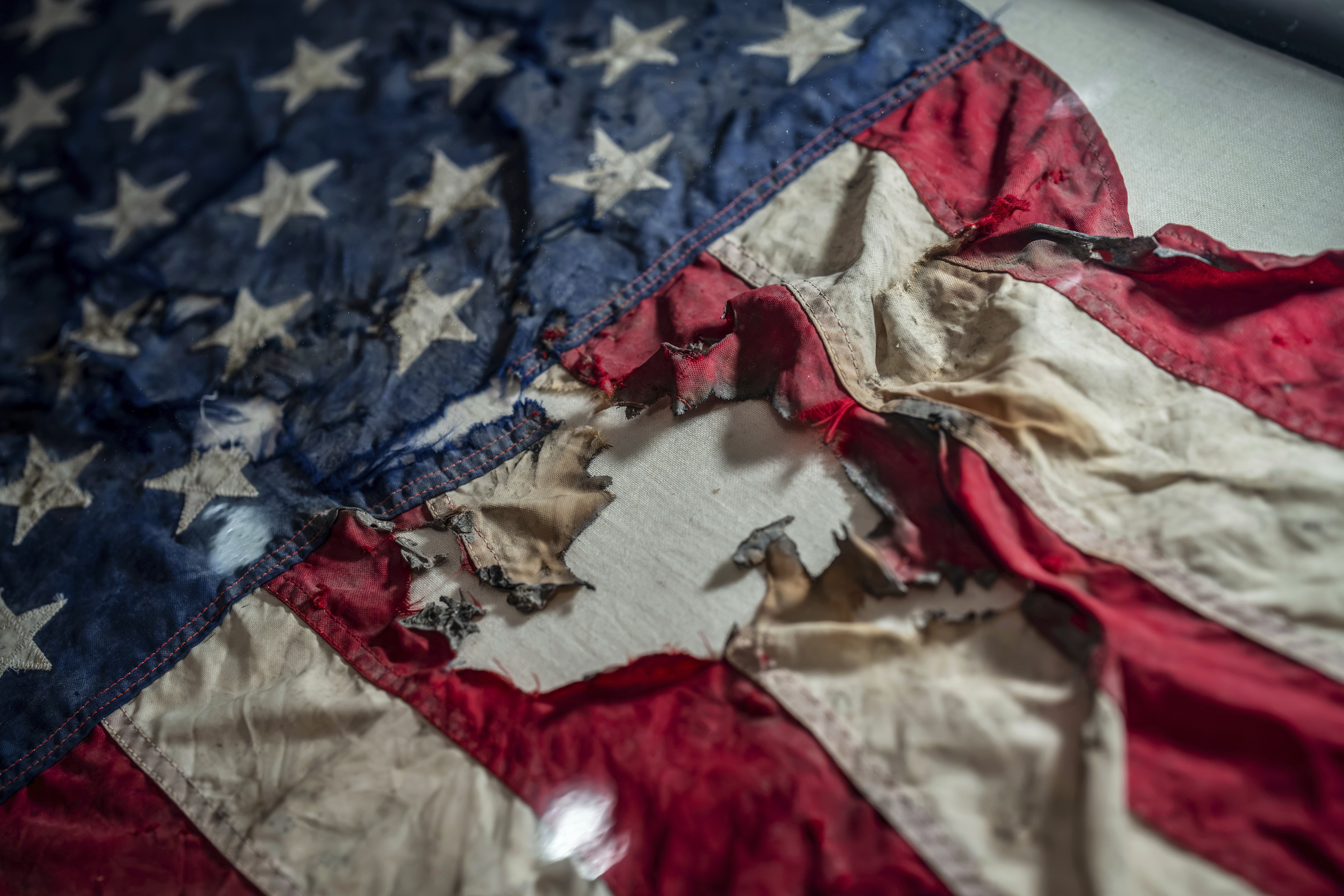 A badly damaged flag recovered from the World Trade Center debris is displayed at the Smithsonian's National Museum of American History, the nation's official repository for September 11 materials, in Washington, Thursday, Sept. 10, 2026. 