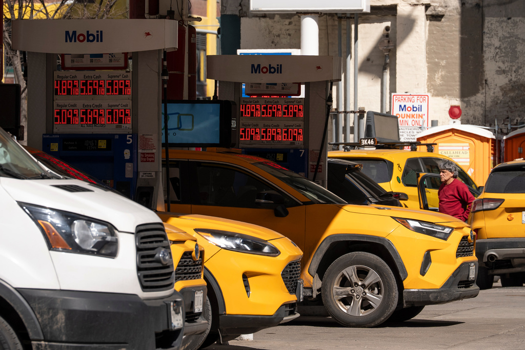 Signs show the gas prices at a gas station, Tuesday, March 10, 2026, in New York. 
