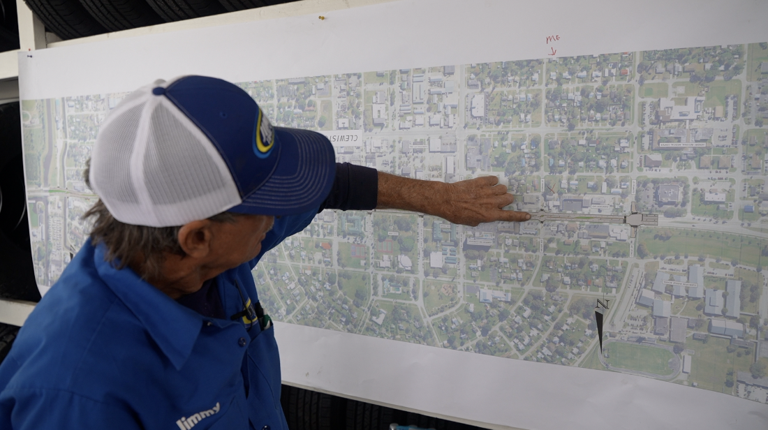 Carlson looks at a map