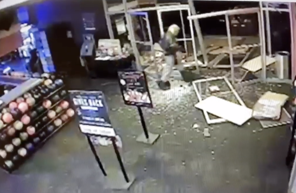 Suspect rams stolen car through bowling alley after breaking into woman's home, abducting her