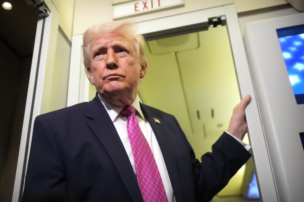 President Donald Trump speaks to reporters aboard Air Force One en route from West Palm Beach, Fla., to Joint Base Andrews, Md., Sunday, March 29, 2026. 