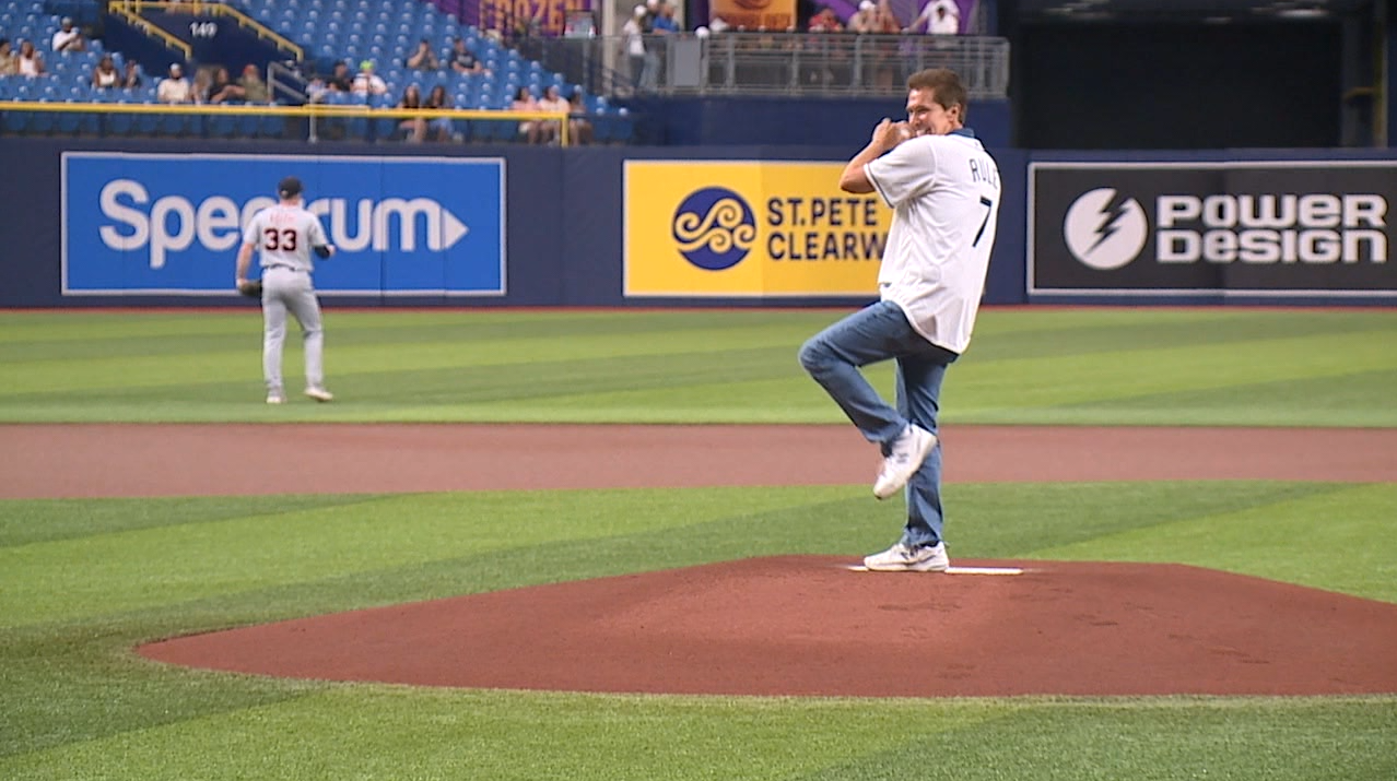 Tampa Bay 28 Chief Meteorologist Denis Philips throws out the first pitch at the Rays game 