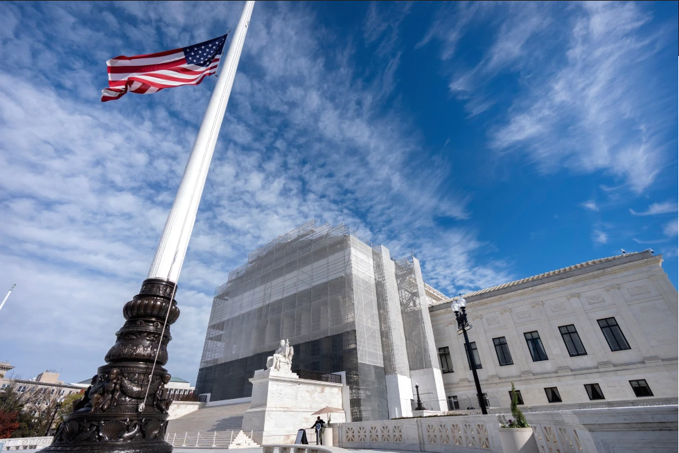 FILE -An American flag flies at half-staff outside the Supreme Court Nov. 5, 2025, in Washington.