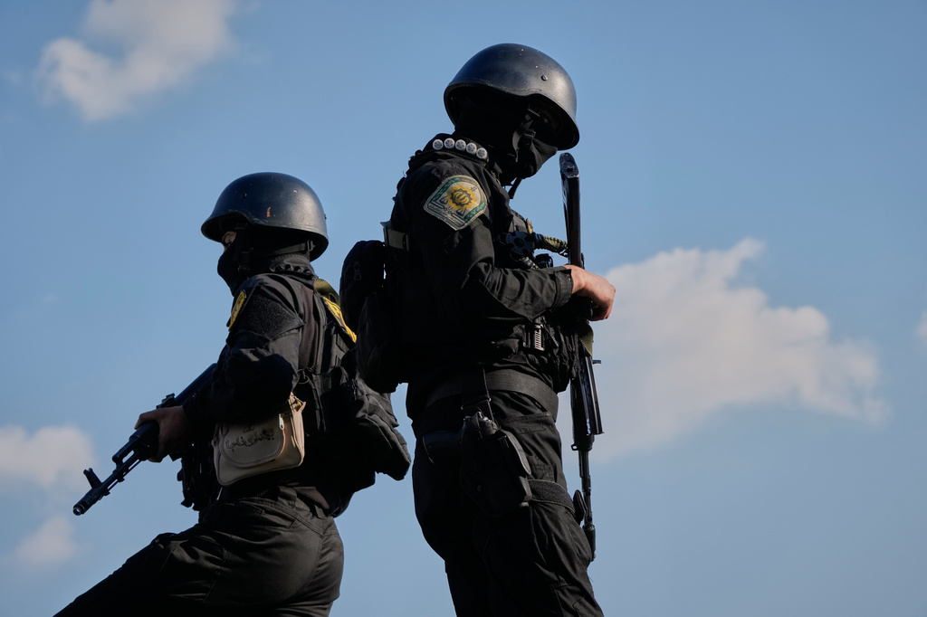 Iranian police special forces stand guard during a funeral procession for Alireza Tangsiri, head of Iran's Islamic Revolutionary Guard Corps Navy, and others killed in Israeli strikes in late March, in Tehran, Iran, Wednesday, April 1, 2026.