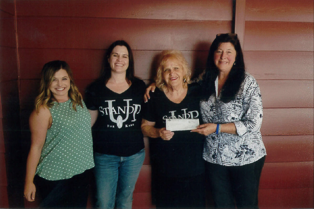 Terilyn Burn (2nd from right) Executive Director of San Diego's Stand Up For Kids